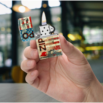 Zippo Flag Design 540 Matte Windproof Lighter lit in hand.