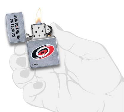 NHL Carolina Hurricanes Street Chrome™ Windproof Lighter lit in hand