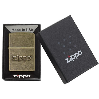 Zippo Stamp Antique Brass Lighter in its packaging.