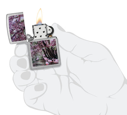 Zippo Carol Cavalaris Flamingo Lagoon Design Street Chrome Windproof Lighter  lit in hand.