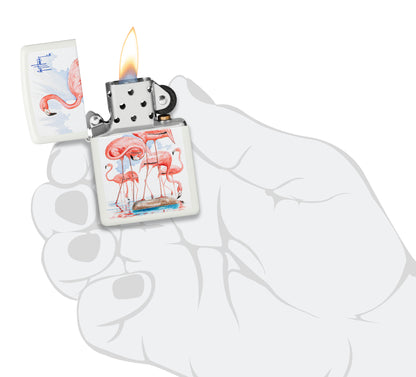 Zippo Guy Harvey Flamingos Design White Matte Windproof Lighter lit in hand.