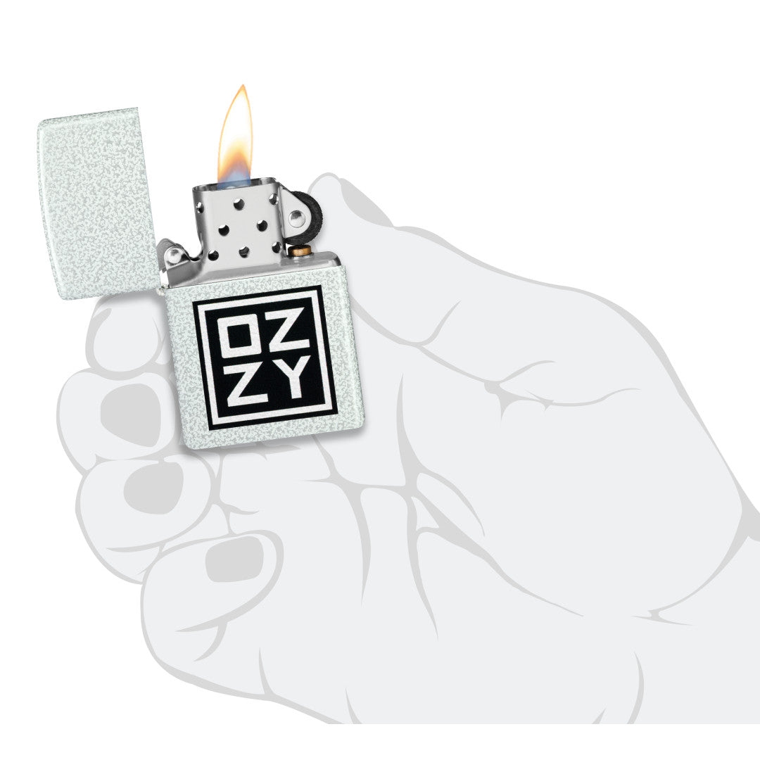 Zippo Ozzy Osbourne Block Design Glacier Windproof Lighter lit in hand.