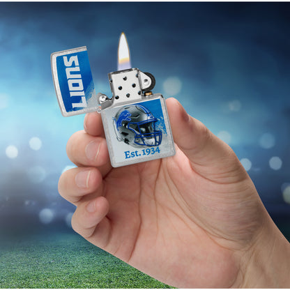 Zippo NFL Detroit Lions Helmet Design Street Chrome Windproof Lighter lit in hand.