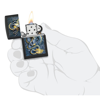 Zippo Stone Dragon Design Black Matte Windproof Lighter lit in hand.