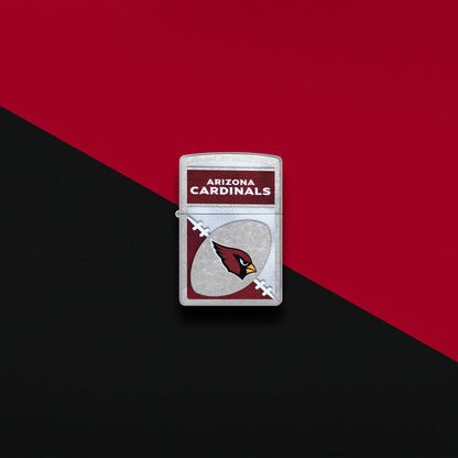 Lifestyle image of Zippo NFL Arizona Cardinals Street Chrome Windproof Lighter set on a red and black background.