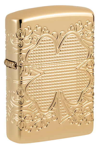 Front shot of Zippo Lucky Clover Design Armor® High Polish Gold Plate Windproof Lighter standing at a 3/4 angle.