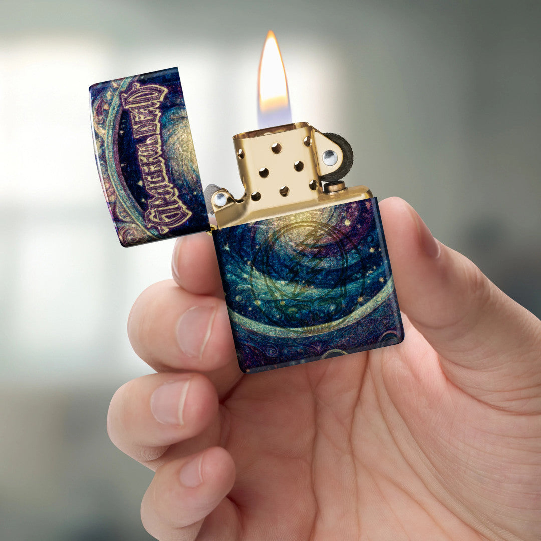 Zippo Grateful Dead Limited Edition Stealie Design Tumbled Brass Windproof Lighter lit in hand.