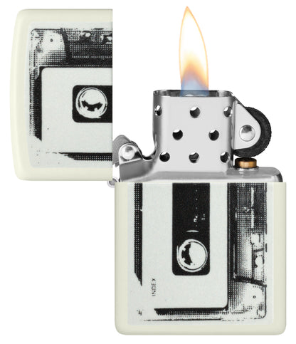 Zippo Cassette Tape Design Glow in the Dark Windproof Lighter with its lid open and lit.