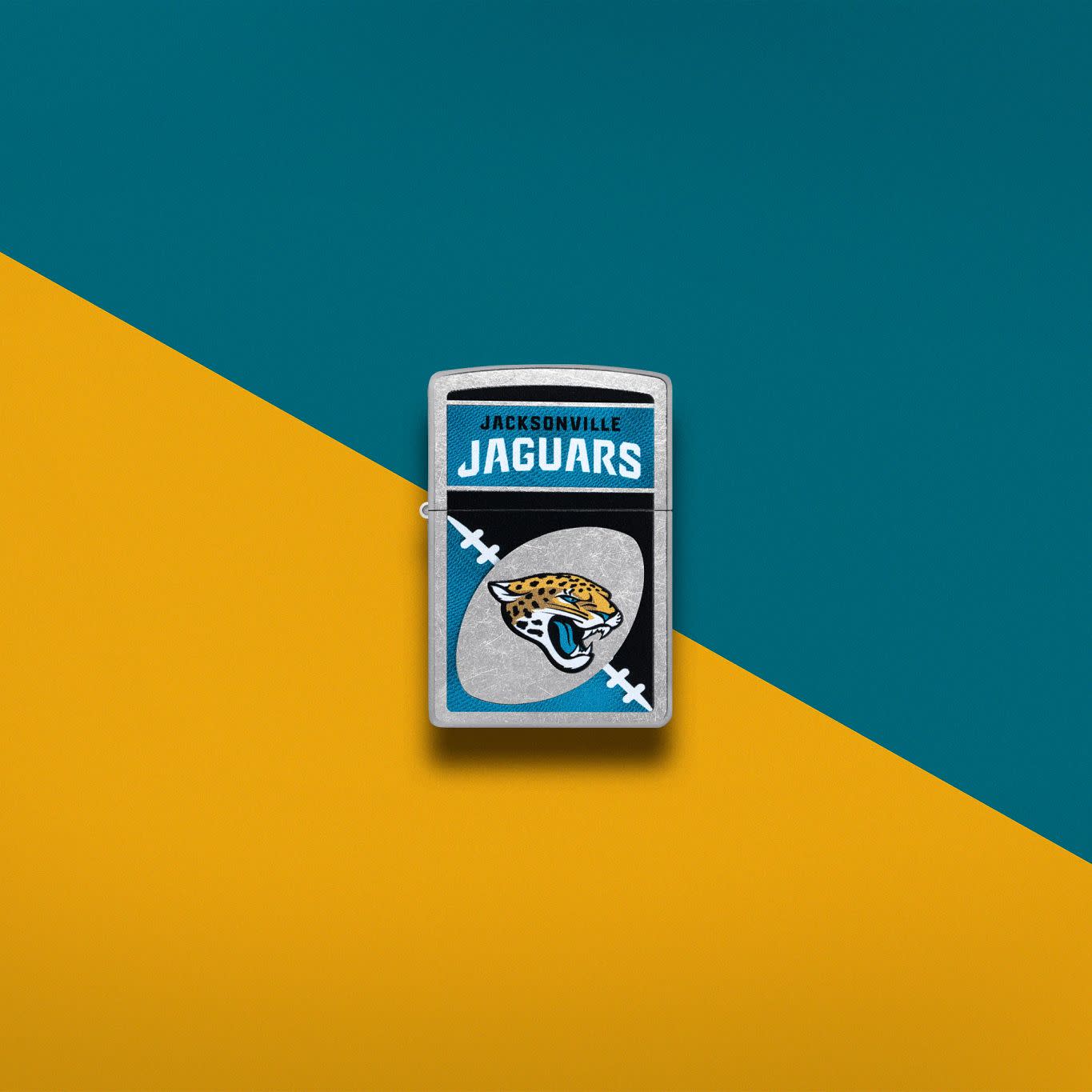 Lifestyle image of Zippo NFL Jacksonville Jaguars Street Chrome Windproof Lighter set on a teal and light orange background.