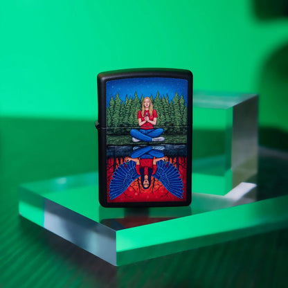 Lifestyle image of Zippo Dual State Design Black Matte Windproof Lighter standing on a clear block showing the front of the lighter with a green background and a clear cube behind the lighter. 