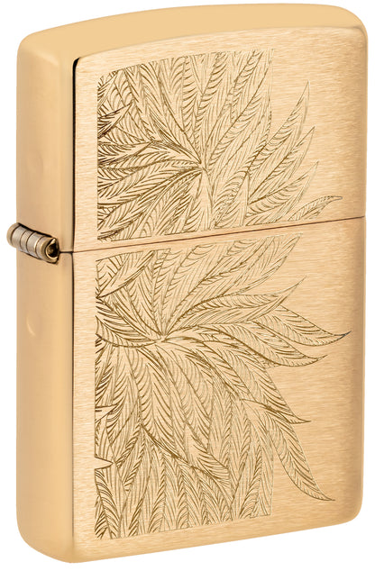 Front shot of Zippo Lush Leaves Design Brushed Brass Windproof Lighter standing at a 3/4 angle.