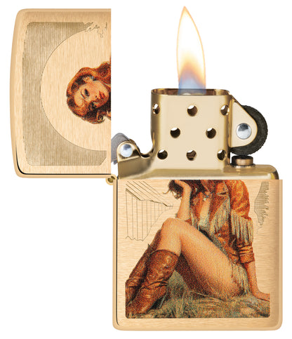 Zippo Western Pinup Design Brushed Brass with its lid open and lit.