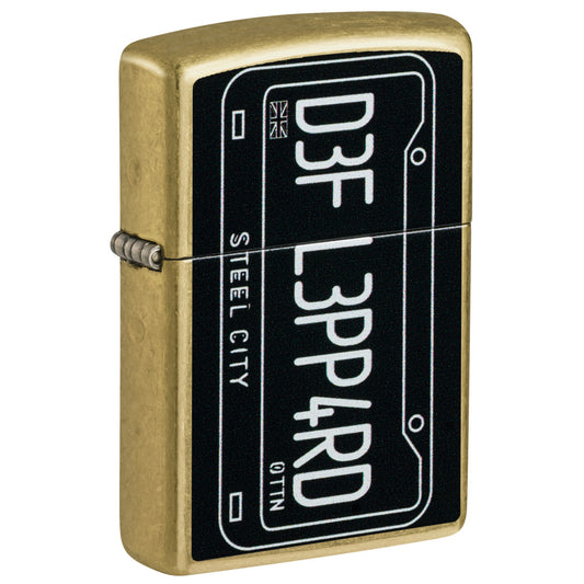 Front shot of Zippo Def Leppard Steel City Design Street Brass Windproof Lighter standing at a 3/4 angle.