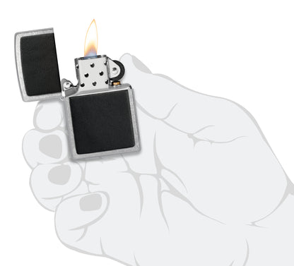 Zippo Black Leather Emblem Street Chrome Windproof Lighter lit in hand.