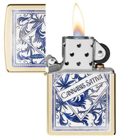 Zippo Sativa Serenity Design Champagne Windproof Lighter with its lid open and lit.