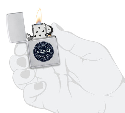 Zippo Dodge Service Sign Satin Chrome Windproof Lighter lit in hand.