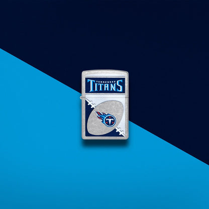 Lifestyle image of Zippo NFL Tennessee Titans Street Chrome Windproof Lighter set on a navy blue and light blue background.