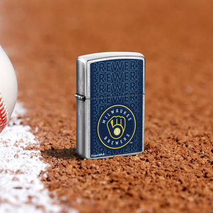 Lifestyle image of Zippo MLB® Milwaukee Brewers Street Chrome Windproof Lighter standing in the dirt on a baseball field.