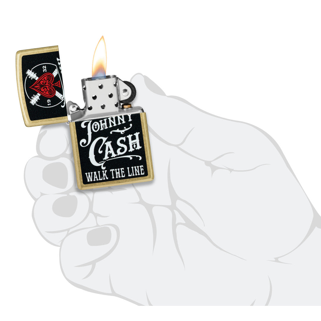 Zippo Johnny Cash 1932 Design Street Brass Windproof Lighter lit in hand.