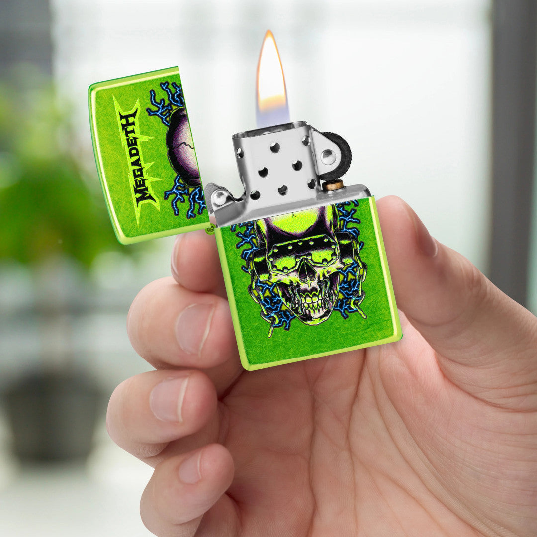 Zippo Megadeth Vic Rattlehead Design Classic Lurid Windproof Lighter lit in hand.