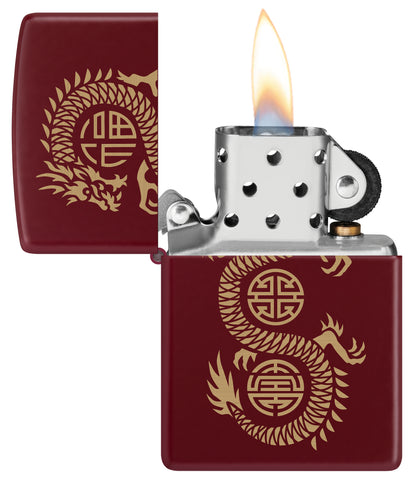 Zippo Lucky Dragon Design Merlot Windproof Lighter with its lid open and lit.
