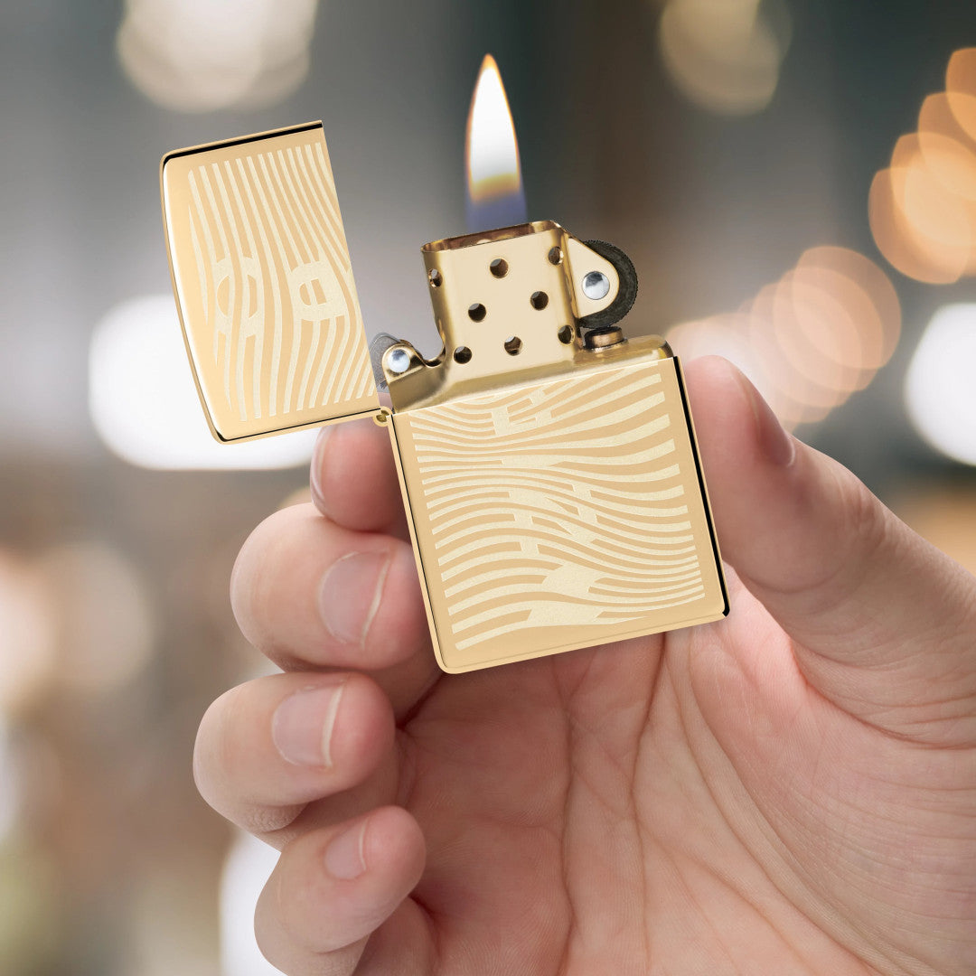 The lighter in the Rolling Tray and Lighter Gift Set lit in hand.