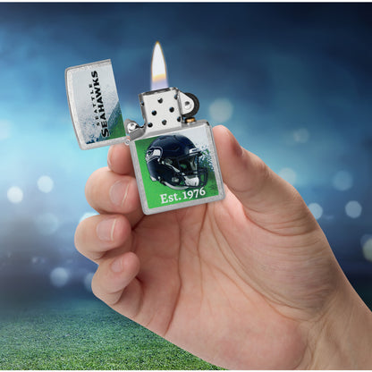 Zippo NFL Seattle Seahawks Helmet Design Street Chrome Windproof Lighter lit in hand.