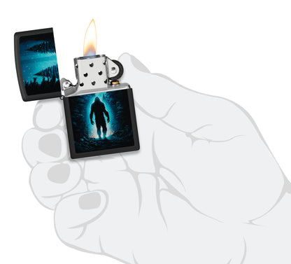 Zippo  Ultra Squatch Design Black Matte Windproof Lighter lit in hand.