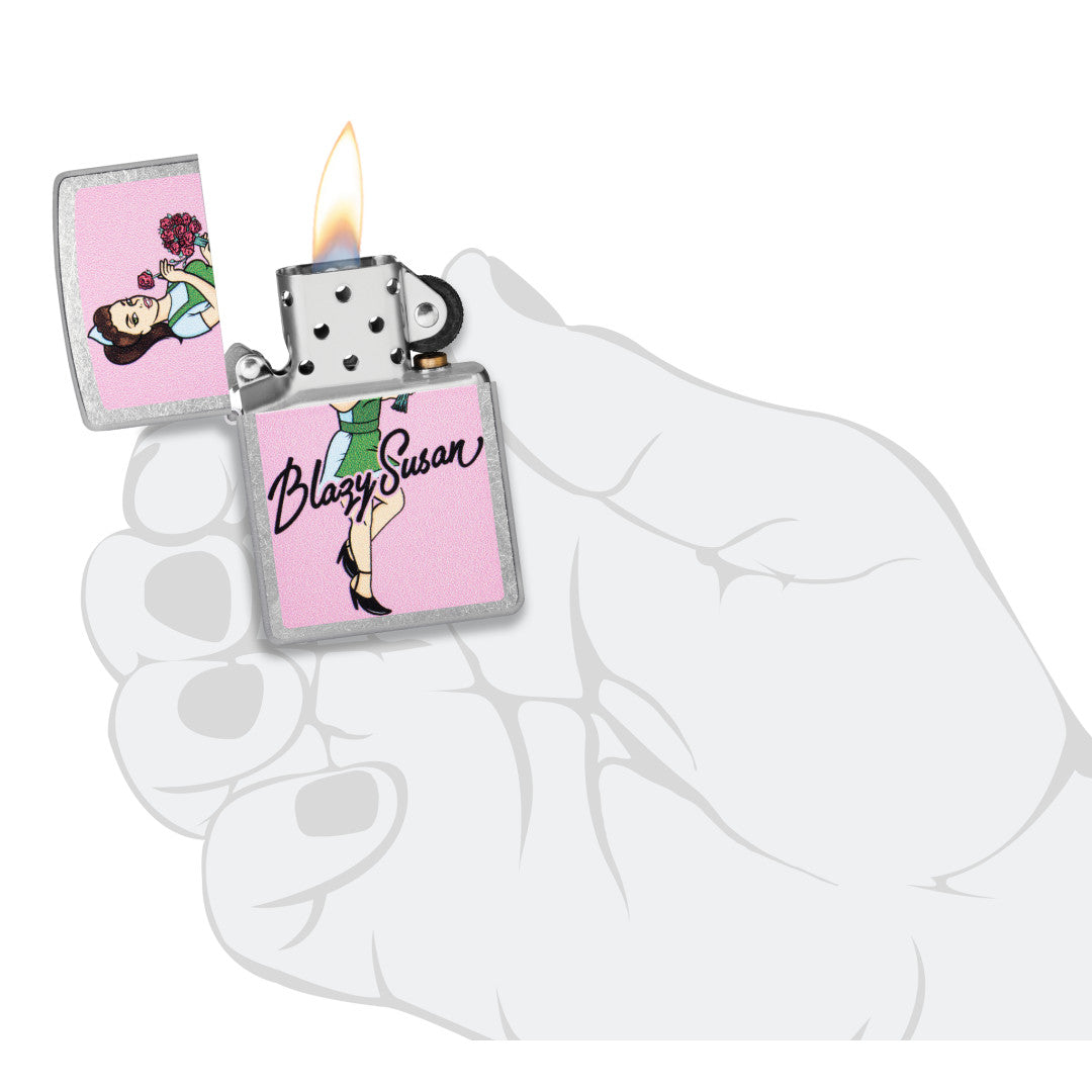 Zippo Blazy Susan Bouquet Design Street Chrome Windproof Lighter lit in hand.
