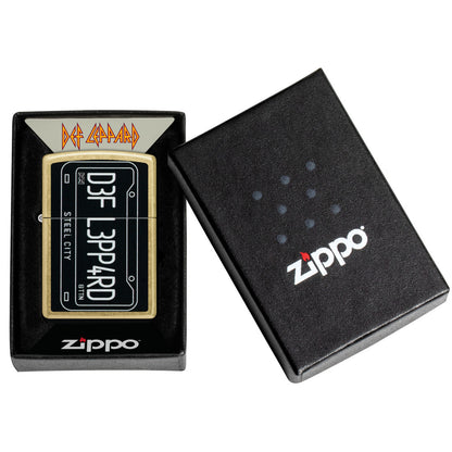 Zippo Def Leppard Steel City Design Street Brass Windproof Lighter in its packaging.