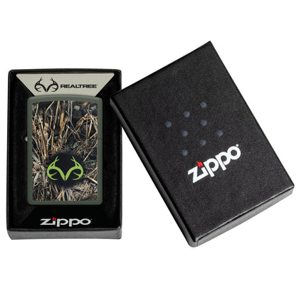 Zippo Realtree® Brush Design Green Matte Windproof Lighter in its packaging.