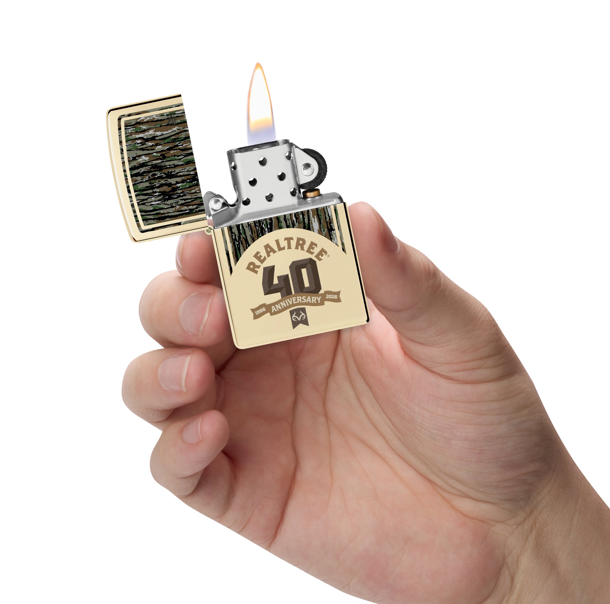 Zippo Realtree® 40th Anniversary Design Champagne Windproof Lighter lit in hand.