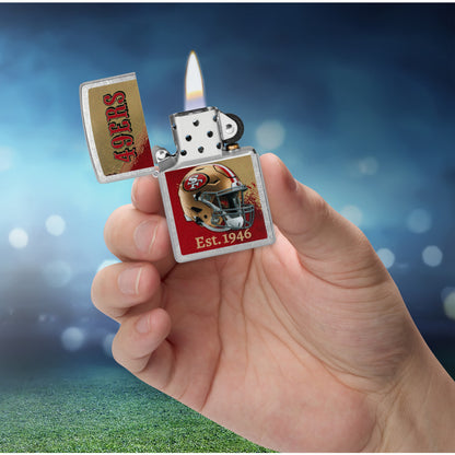 Zippo NFL San Francisco 49ers Helmet Design Street Chrome Windproof Lighter lit in hand.