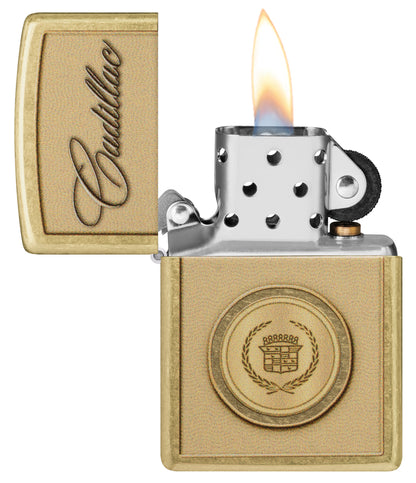 Zippo Cadillac Crest Design Street Brass Windproof Lighter with its lid open and lit.


