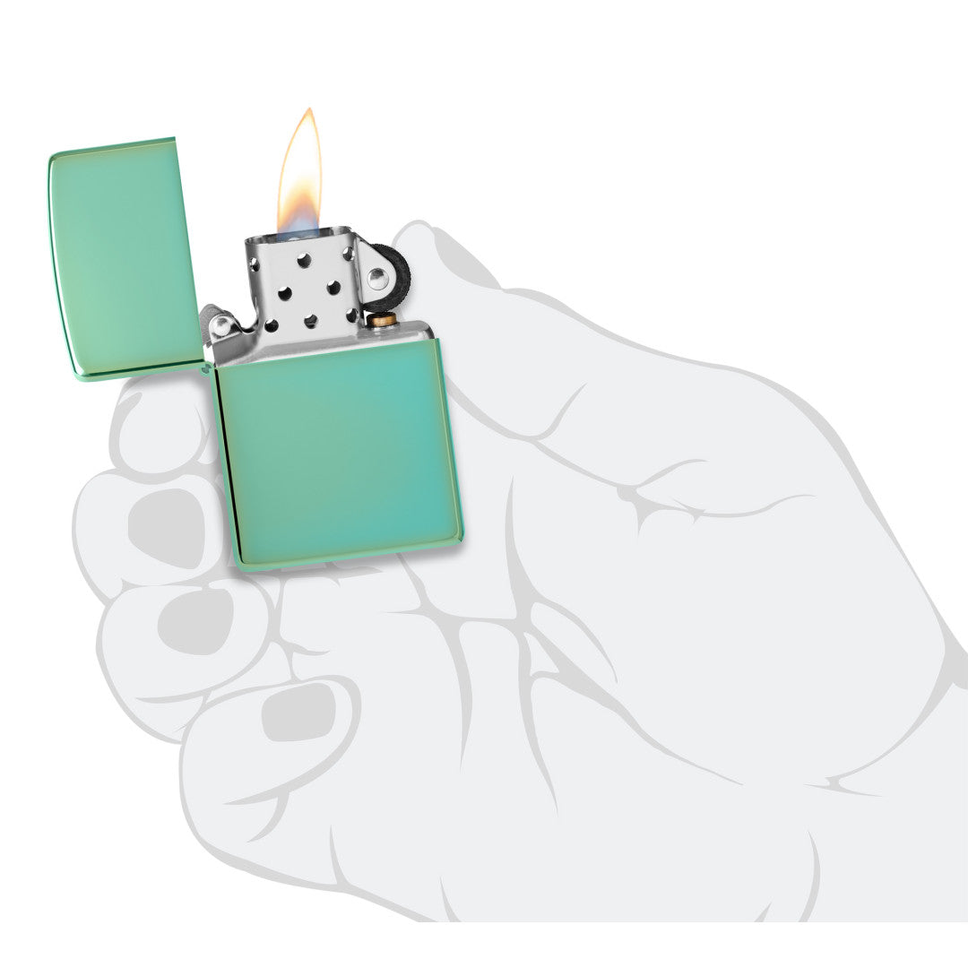 Classic High Polish Green Windproof Lighter lit in hand.