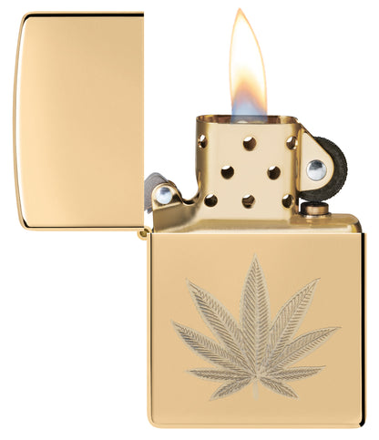 Zippo Cannabis Leaf Design High Polish Brass Windproof Lighter with its lid open and lit.