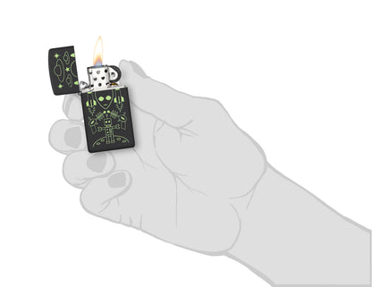 Zippo Alien Invasion Design Slim® Black Matte Windproof Lighter lit in hand.