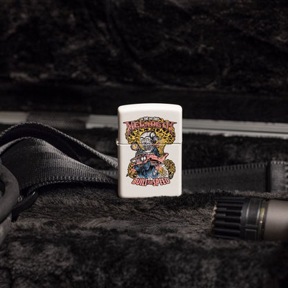 Lifestyle image of Zippo Megadeth Built for Speed Design White Matte Windproof Lighter standing inside of an open peli case showing the front of the lighter. 


