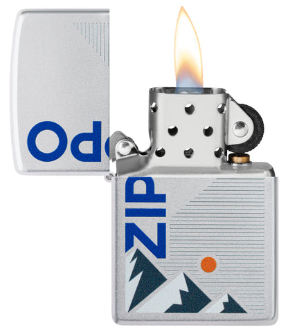 Zippo Mountain Design Satin Chrome Windproof Lighter with its lid open and lit.