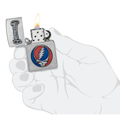 Zippo Grateful Dead Steal Your Face Design Street Chrome Windproof Lighter lit in hand.