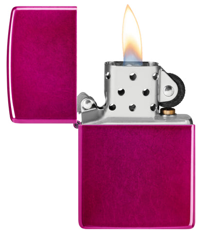Zippo Classic Candy Raspberry Windproof Lighter with its lid open and lit.