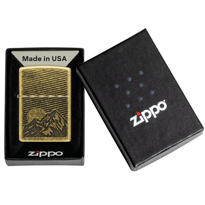 Zippo Etched Mountains Design Antique Brass Windproof Lighter in its packaging.