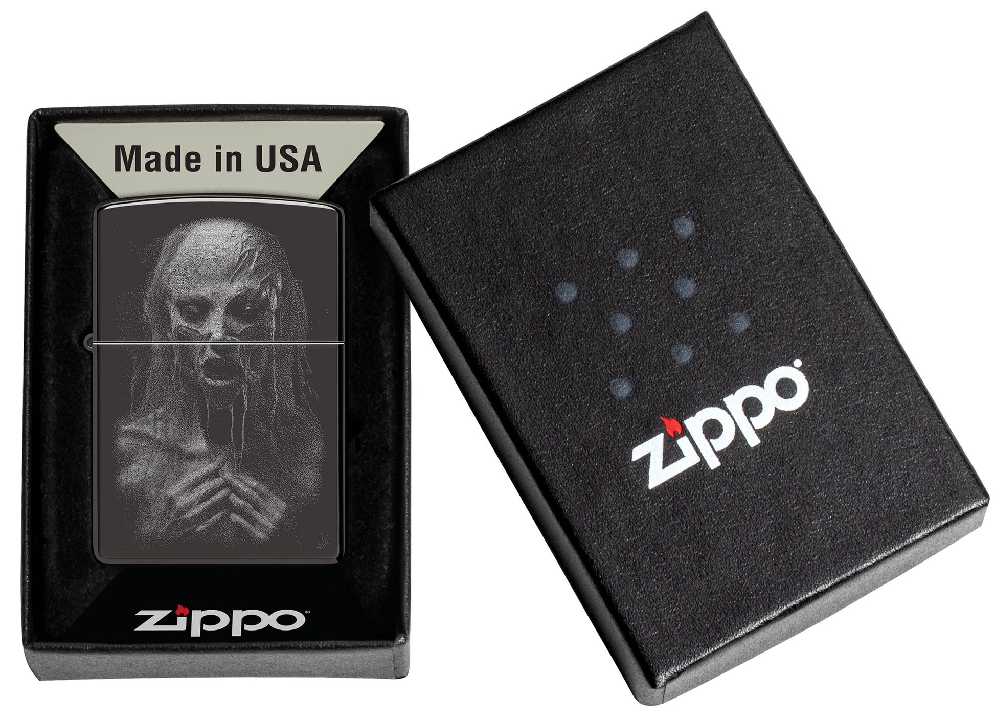 Zippo Monster Design High Polish Black Windproof Lighter in its packaging.