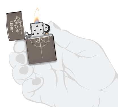 Zippo Jeep® Wilderness Design Black Ice Windproof Lighter lit in hand.