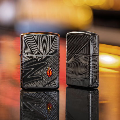 Lifestyle image of two Zippo Z Crystal Design Armor® High Polish Black Windproof Lighters standing on a bar; one showing the front of the lighter, while the other is showing the back and hinge side of the lighter. 

