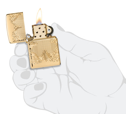 Zippo Lucky Clover Design Armor® High Polish Gold Plate Windproof Lighter lit in hand.