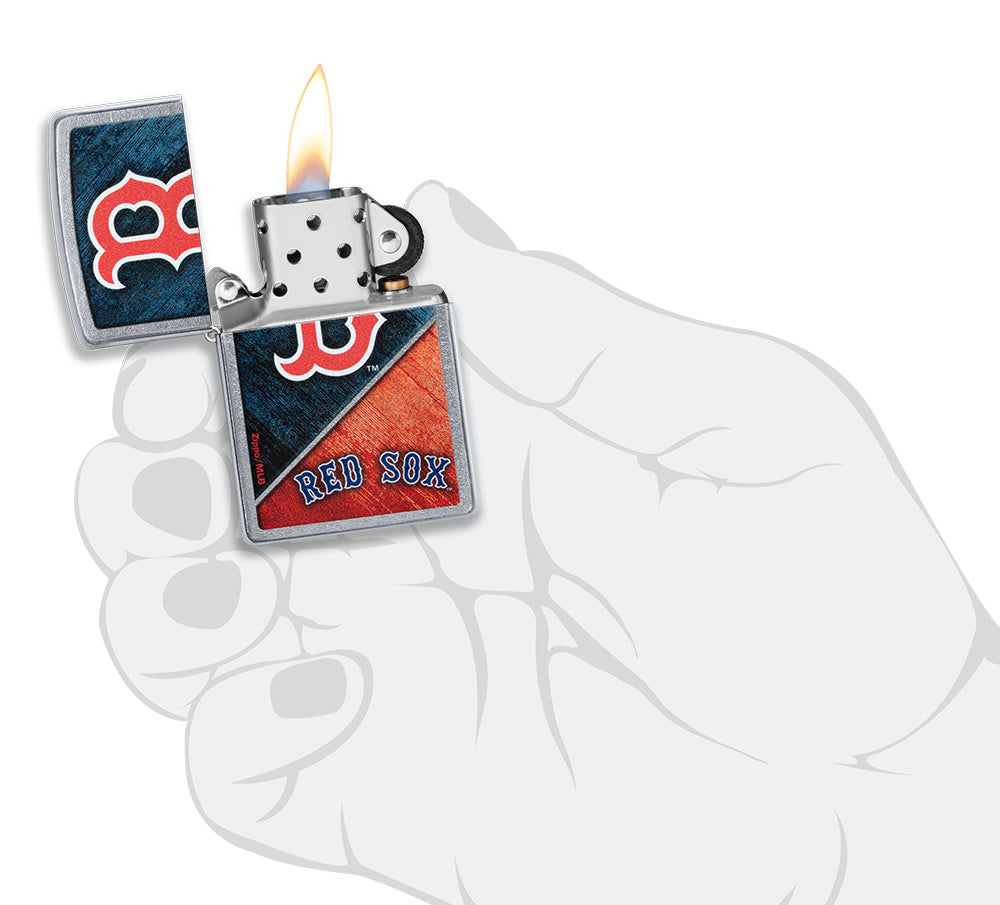 MLB® Boston Red Sox™ Street Chrome™ Windproof Lighter lit in hand.