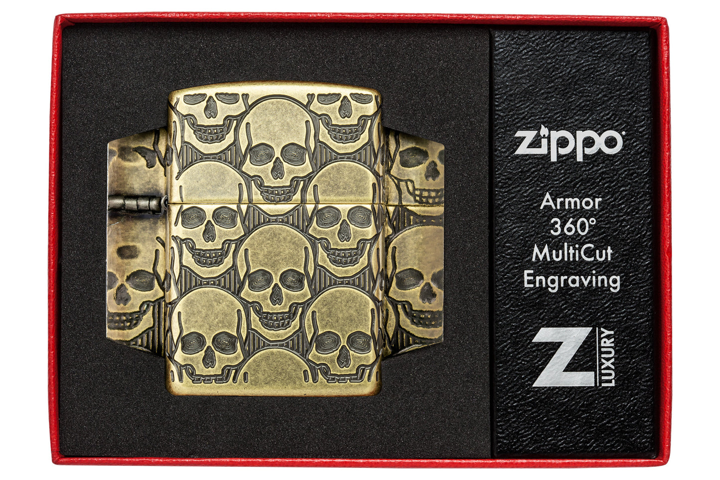 Zippo Cackling Cranium Design Armor® Antique Brass Windproof Lighter in its packaging.