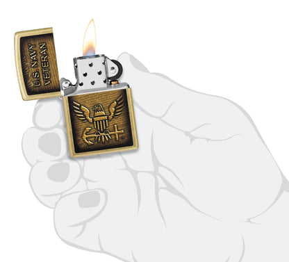 Zippo United States Navy® Street Brass Windproof Lighter lit in hand.