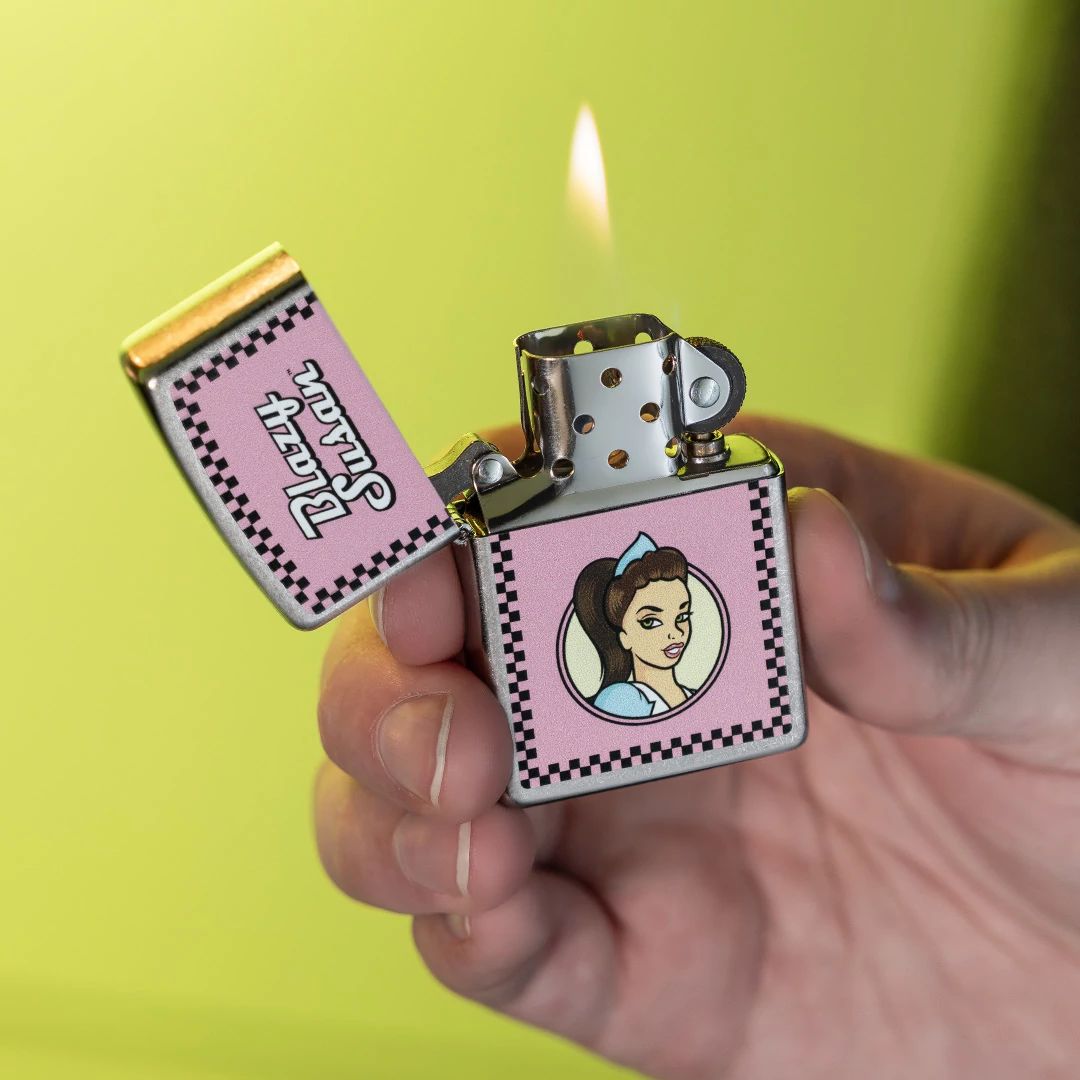 Lifestyle image of Zippo Blazy Susan™ Checker Design Street Chrome Windproof Lighter lit in hand showing the front of the lighter with a lime green background. 